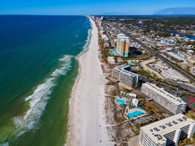 an aerial view of a beach with buildings and the ocean at Dunes of Panama E1702 - Sunrise & Sea Breezes in Panama City Beach