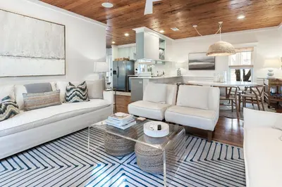 a living room with a couch and a table at Fin and Tonic - Magnolia Cottages 3 BR, Heated Community Pool, Bikes in Inlet Beach