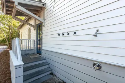 a front door of a house with a porch at Fin and Tonic - Magnolia Cottages 3 BR, Heated Community Pool, Bikes in Inlet Beach