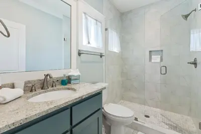 a bathroom with a sink and a toilet and a shower at Seacrest Beach - 3 BR, Bikes, Pool & Beach in Rosemary Beach