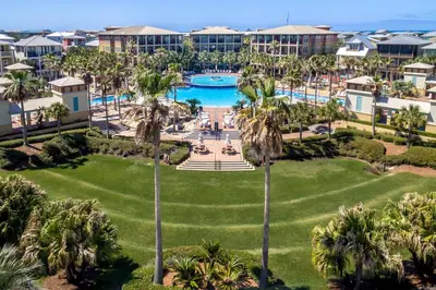 an aerial view of a resort with a pool and palm trees at Seacrest Beach - 3 BR, Bikes, Pool & Beach in Rosemary Beach