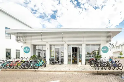 a building with bikes parked in front of it at Prominence- 3 BR, steps to the resort style pool, Big Chill & Bikes in Santa Rosa Beach