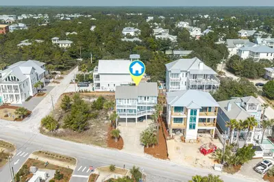 an aerial view of a city with houses at New Kululu WEST- 3 BR, Sleeps 11, Heated Salt Water Pool, Bikes & moments from the beach in Santa Rosa Beach
