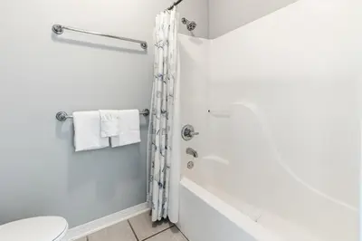 a bathroom with a shower and a toilet at New Kululu WEST- 3 BR, Sleeps 11, Heated Salt Water Pool, Bikes & moments from the beach in Santa Rosa Beach