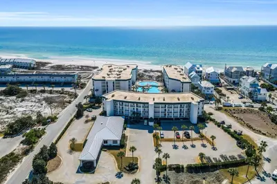 an aerial view of a resort near the ocean at Beautifully decorated oceanfront condo with resort pool & huge walk-in showers in Santa Rosa Beach