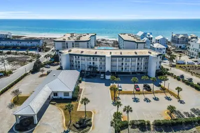 an aerial view of a hotel near the ocean at Beautifully decorated oceanfront condo with resort pool & huge walk-in showers in Santa Rosa Beach