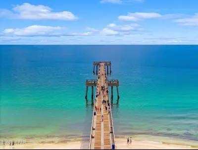 a wooden pier in the middle of the ocean at Bexley Blue in Panama City Beach