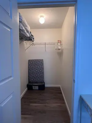 a hallway with a chair in a room at Bexley Blue in Panama City Beach
