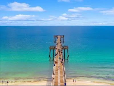 a wooden pier in the middle of the ocean at Bexley Blue in Panama City Beach