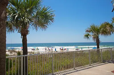 a view of a beach with palm trees and the ocean at Bikini Beach Resort in Panama City Beach
