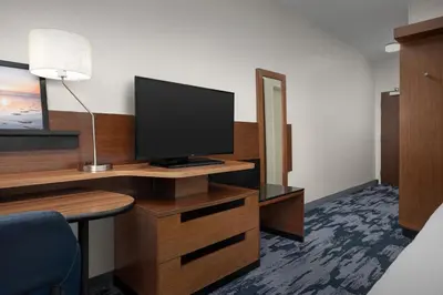 a room with a desk with a television on it at Fairfield Inn & Suites by Marriott Panama City Beach in Panama City Beach