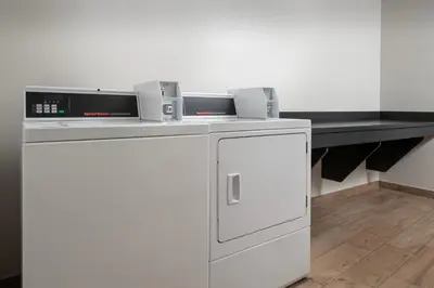 a kitchen with a washer and dryer on a counter at Fairfield Inn & Suites by Marriott Panama City Beach in Panama City Beach