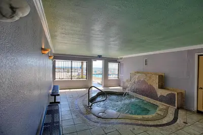 a bathroom with a tub with a water fountain at Regency Towers by Panhandle Getaways in Panama City Beach
