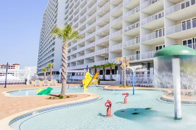 a pool with a water park in front of a hotel at Laketown Wharf Resort by Panhandle Getaways in Panama City Beach