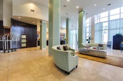 a lobby with a couch and chairs in a building at Laketown Wharf Resort by Panhandle Getaways in Panama City Beach