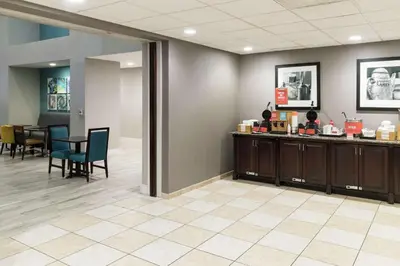 a waiting room at a hospital with a counter and chairs at Hampton Inn & Suites Panama City Beach-Pier Park Area in Panama City Beach