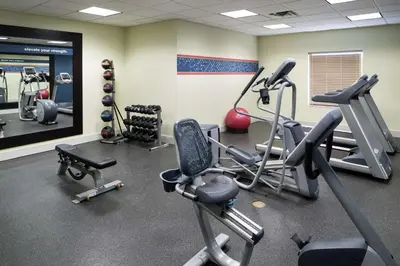 a gym with cardio equipment in a room at Hampton Inn & Suites Panama City Beach-Pier Park Area in Panama City Beach