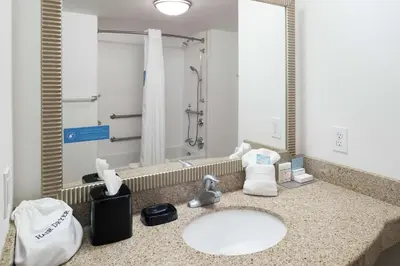 a bathroom with a sink and a shower at Hampton Inn & Suites Panama City Beach-Pier Park Area in Panama City Beach