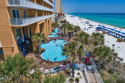 an aerial view of a resort with a pool and a beach at Splash Beach Resort by Panhandle Getaways in Panama City Beach