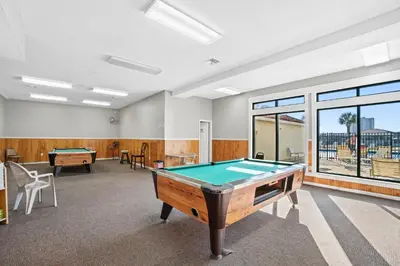 a room with a pool table in it at Horizon South by Panhandle Getaways in Panama City Beach