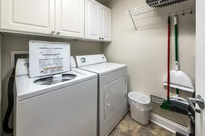 a white washer and dryer in a laundry room at Calypso 1-609 East in Panama City Beach