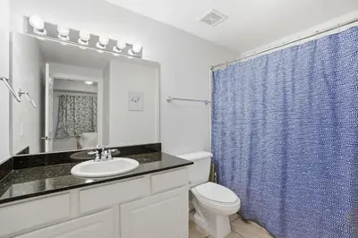 a bathroom with a sink and a toilet and a shower at Calypso 2-1907 West in Panama City Beach