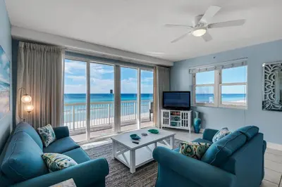 a living room with a view of the ocean at Celadon 309 in Panama City Beach