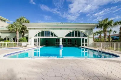 a swimming pool in front of a house at Celadon 309 in Panama City Beach