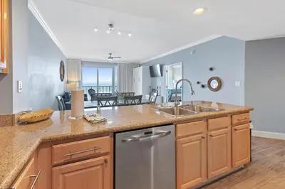 a kitchen with a sink and a counter top at Grandview East 1203 in Panama City Beach