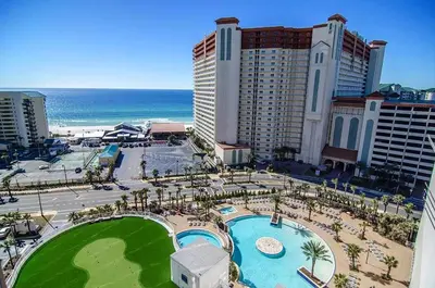 an aerial view of a resort with a pool and the ocean at Laketown Wharf 1326 in Panama City Beach