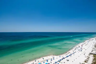an aerial view of a beach with people in the water at Majestic Beach Towers 2-1905 in Panama City Beach