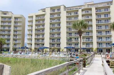 a view of a hotel from the beach at Moonspinner 211B - PCB East in Panama City Beach