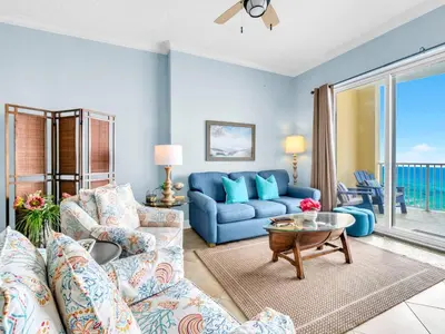 a living room with a couch and a table at Ocean Villa Penthouse #2302 in Panama City Beach