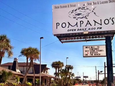 a sign for a pomonos open daily pm at Ocean Villa Penthouse #2302 in Panama City Beach