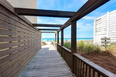 a boardwalk to the beach from a beach house at Origin at Seahaven 825 in Panama City Beach