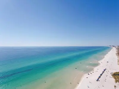 an aerial view of a beach with people and the ocean at Seychelles 207 in Panama City Beach