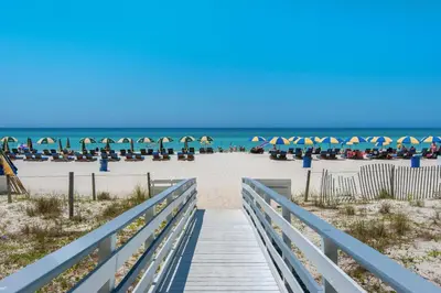 a boardwalk to the beach with the ocean in the background at Twin Palms 804 in Panama City Beach