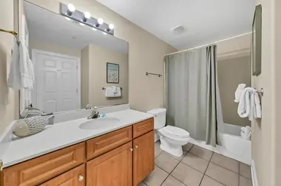 a bathroom with a sink and a toilet and a shower at Twin Palms 804 in Panama City Beach