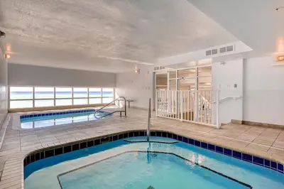 a swimming pool in the middle of a building at Tidewater Beach Resort by Panhandle Getaways in Panama City Beach