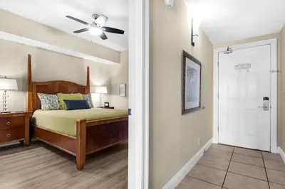 a bedroom with a bed and a ceiling fan at Calypso Resort Tower 1 Unit 1606 (3/2) in Panama City Beach