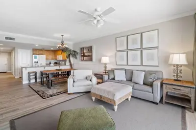 a living room with a couch and a table at Grandview East 903 (3/2) in Panama City Beach