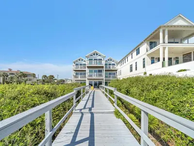 a boardwalk leading to the beach with houses at Ramsgate 3 in Watersound Beach