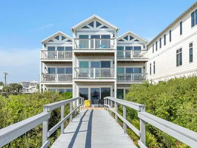 a large white house with a boardwalk leading to it at Ramsgate 3 in Watersound Beach