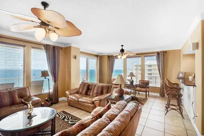 a living room with a couch and a table at Treasure Island 2212 in Panama City Beach