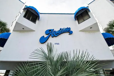 a building with a sign on the side of it at Aquavista 304W in Panama City Beach
