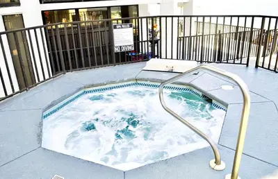 a jacuzzi tub with a shower in it at Aquavista 304W in Panama City Beach