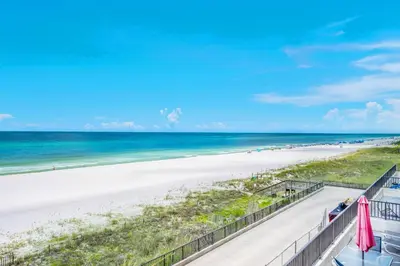 a view of the beach from the balcony of a condo at Aquavista 304W in Panama City Beach