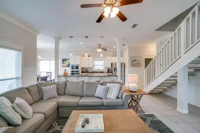 a living room with a couch and a table at 30A Beach House - Walking on Sunshine in Inlet Beach