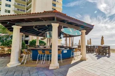 a gazebo with a bar on the beach at Shores of Panama by Panhandle Getaways in Panama City Beach