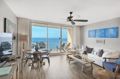 a living room with a view of the ocean at Majestic Beach Towers 1-1006 in Panama City Beach